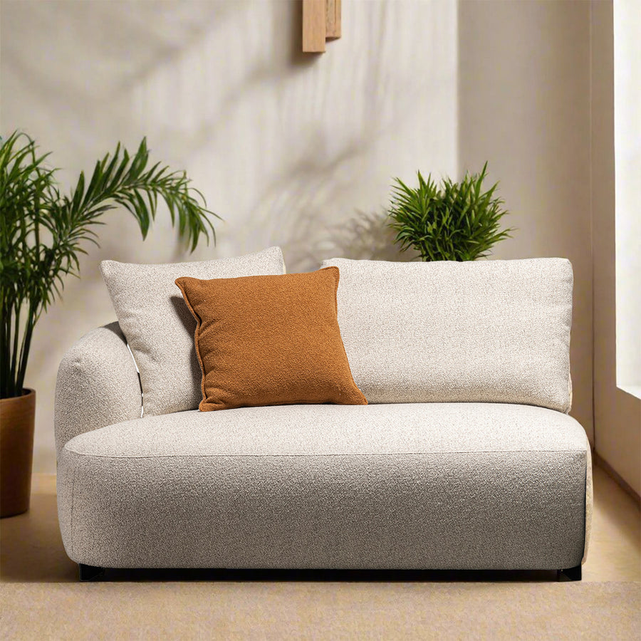 Modern boucle fabric modular corner 1 seater sofa serene in panoramic view.