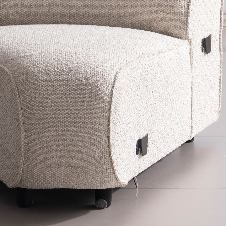 Modern boucle fabric modular joint connection 1 seater sofa colle in close up details.