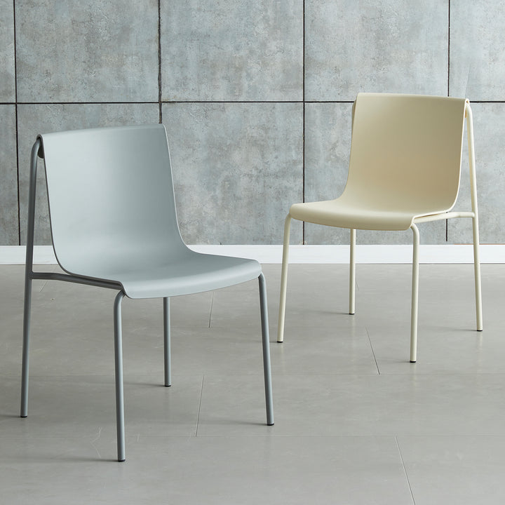 Contemporary plastic stackable dining chair buzz layered structure.