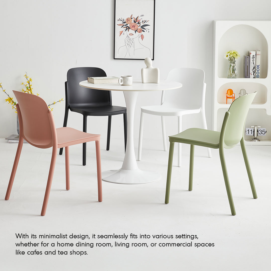 Contemporary plastic stackable dining chair glint in real life style.