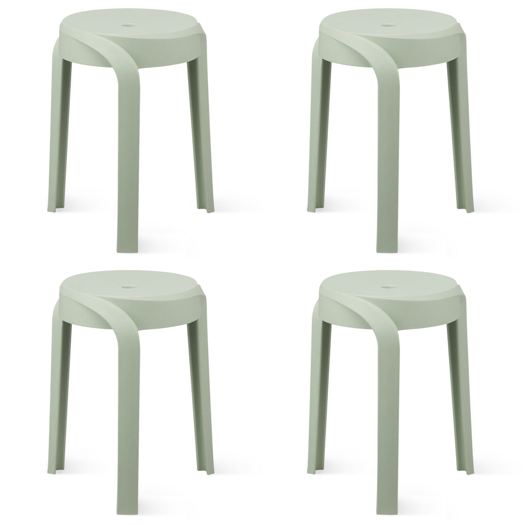 Modern plastic stackable dining stool 4pcs set whirl in white background.