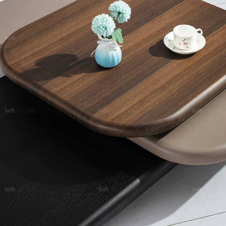 Modern wood revolving coffee table lumina with context.