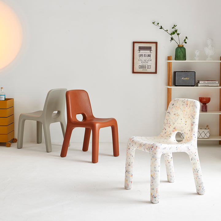 Modern plastic dining chair poky in real life style.