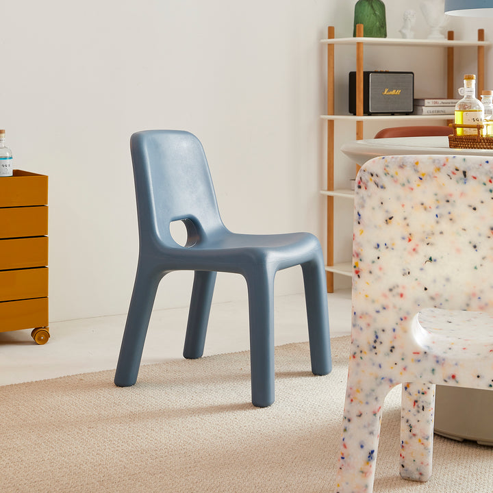 Modern plastic dining chair poky in panoramic view.