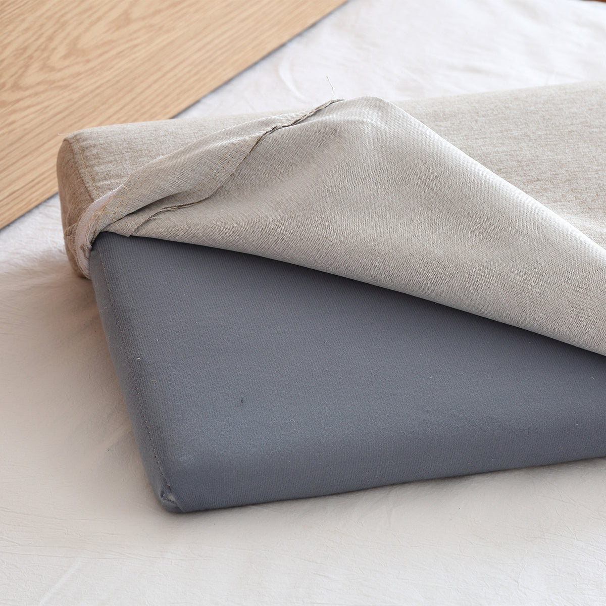 Scandinavian fabric bed panel headboard cushion ease in still life.