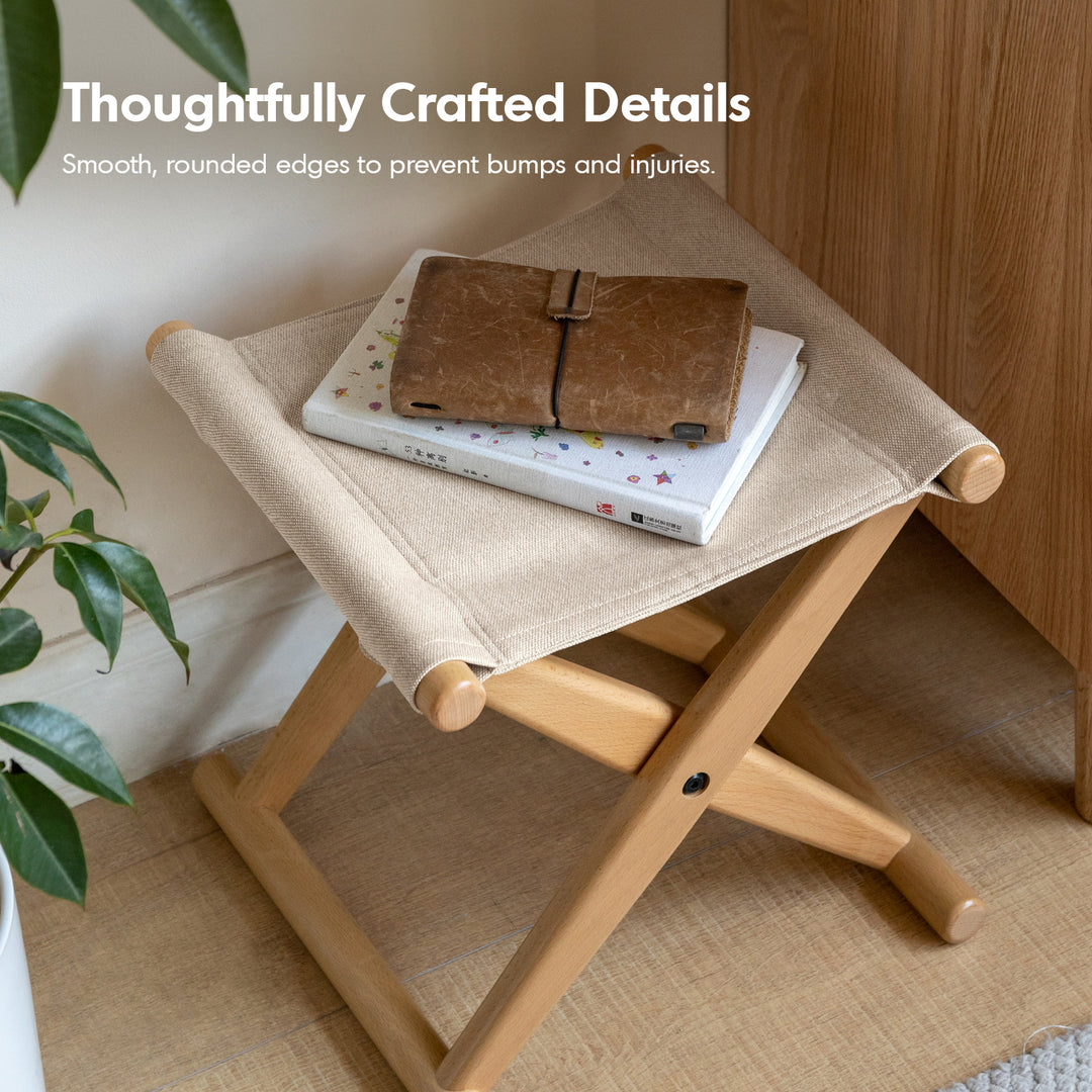 Scandinavian beech wood canvas folding stool kaya in still life.