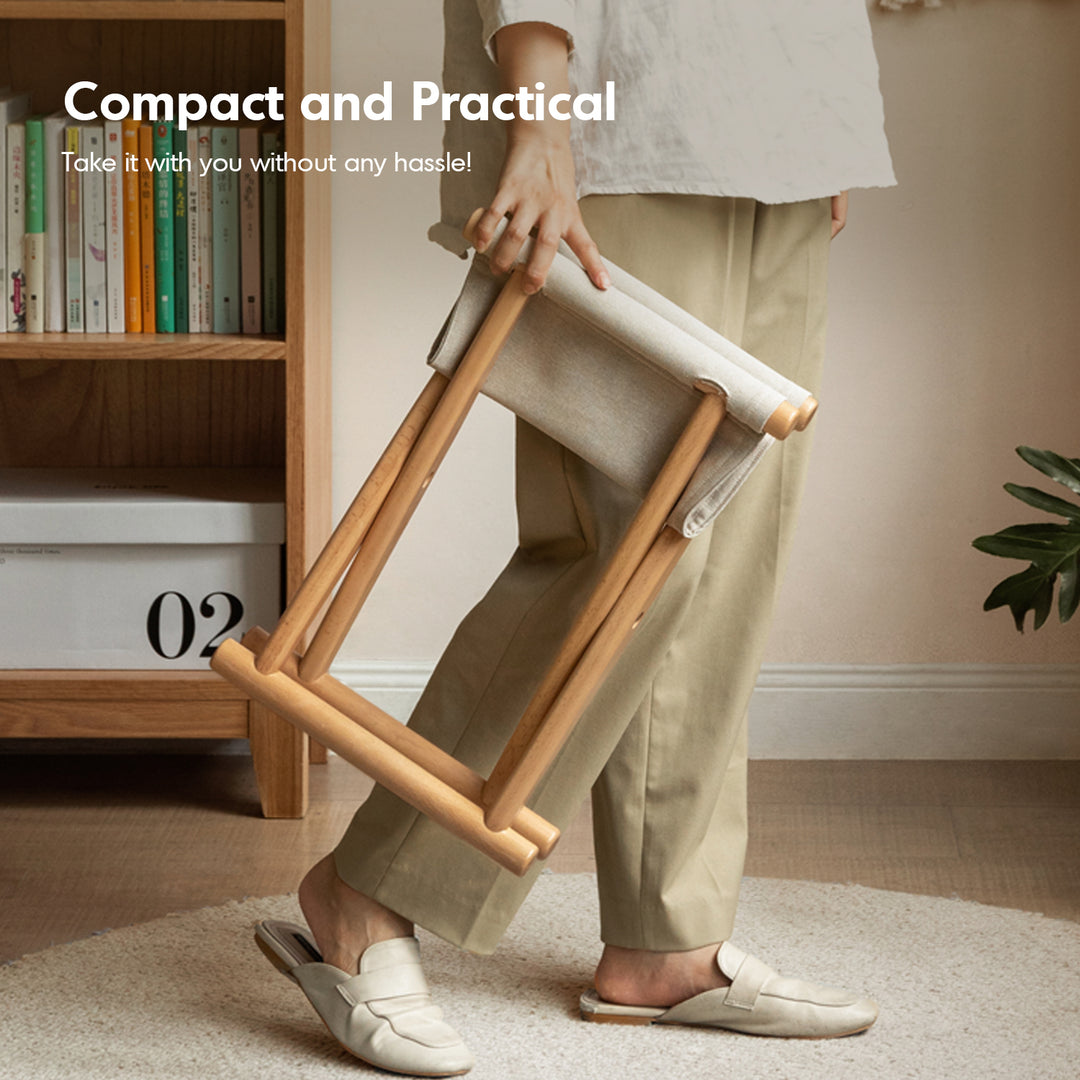 Scandinavian beech wood canvas folding stool kaya in close up details.