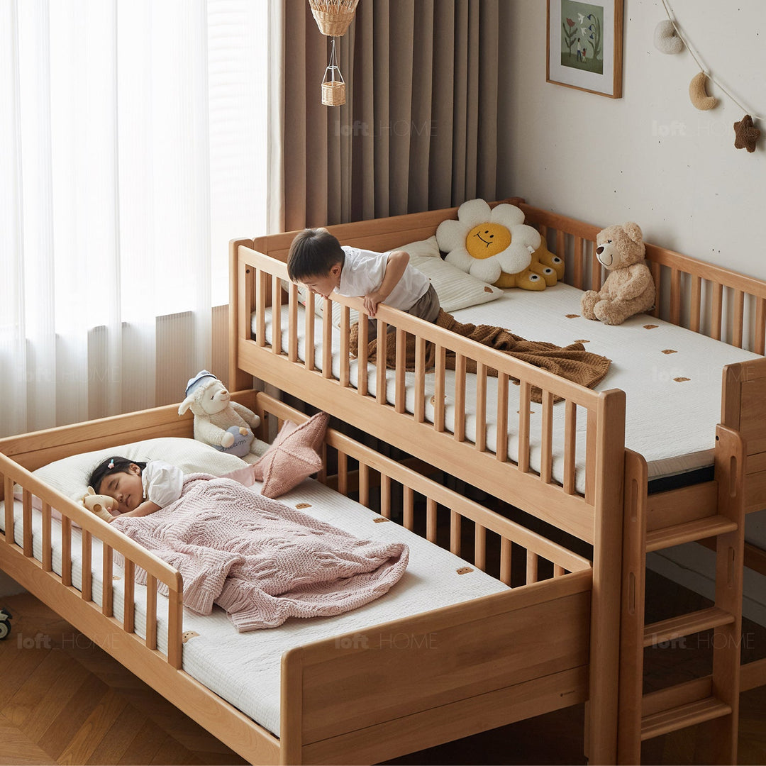 Scandinavian beech wood kids bunk bed with trundle cubble with context.