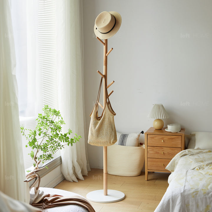 Scandinavian beech wood quartz stone base clothes hanger pebble with context.