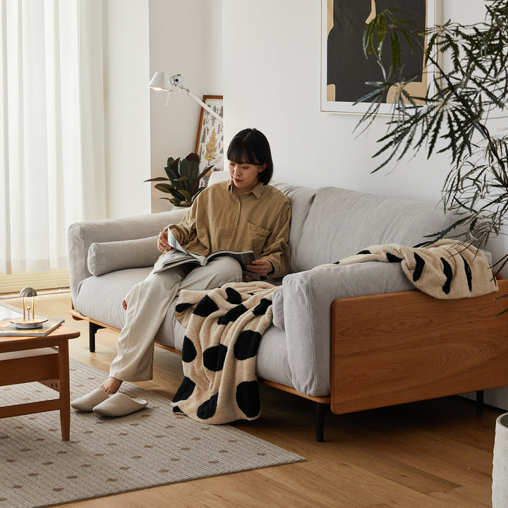 Scandinavian boucle fabric 3 seater sofa harvest in still life.