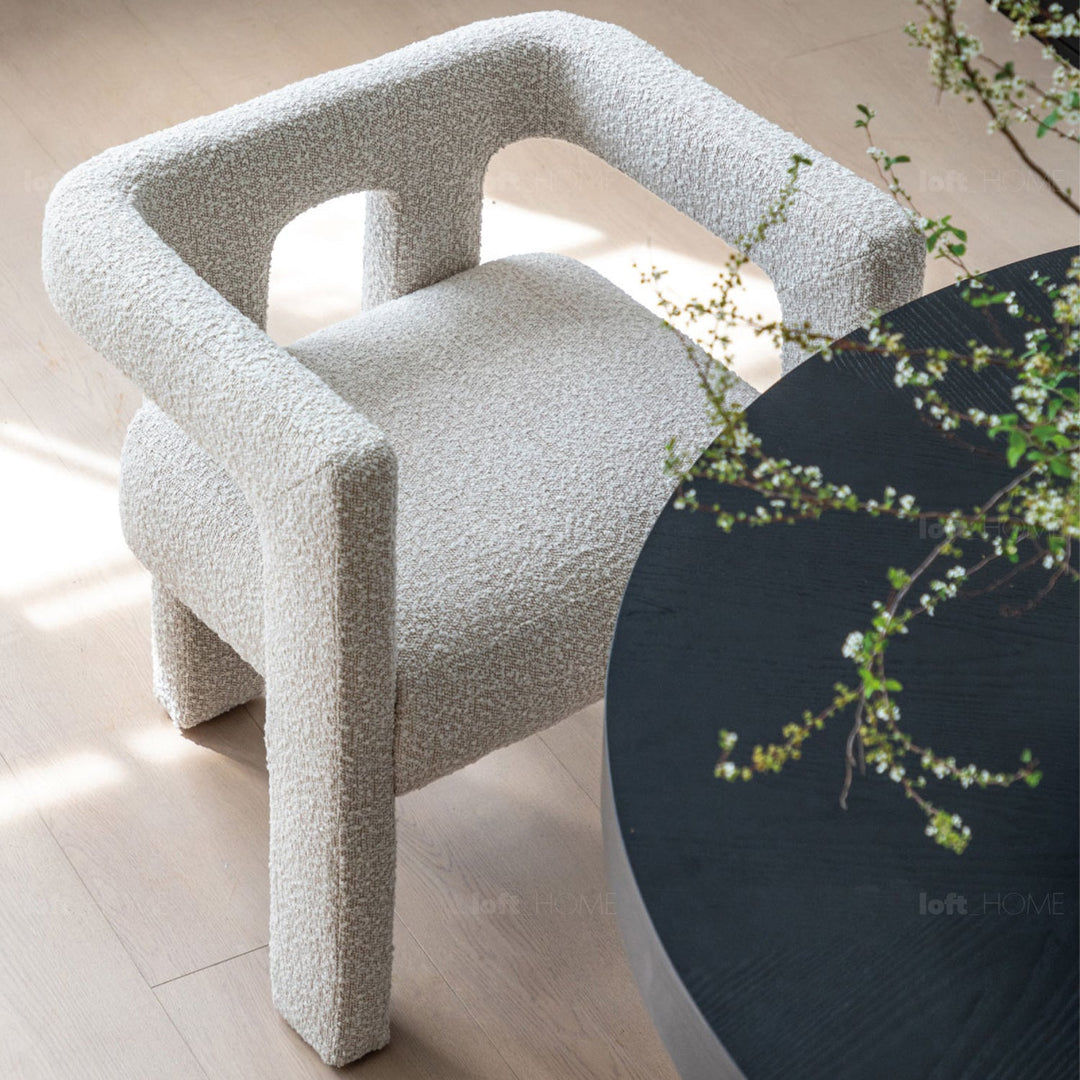 Scandinavian boucle fabric dining chair whim conceptual design.