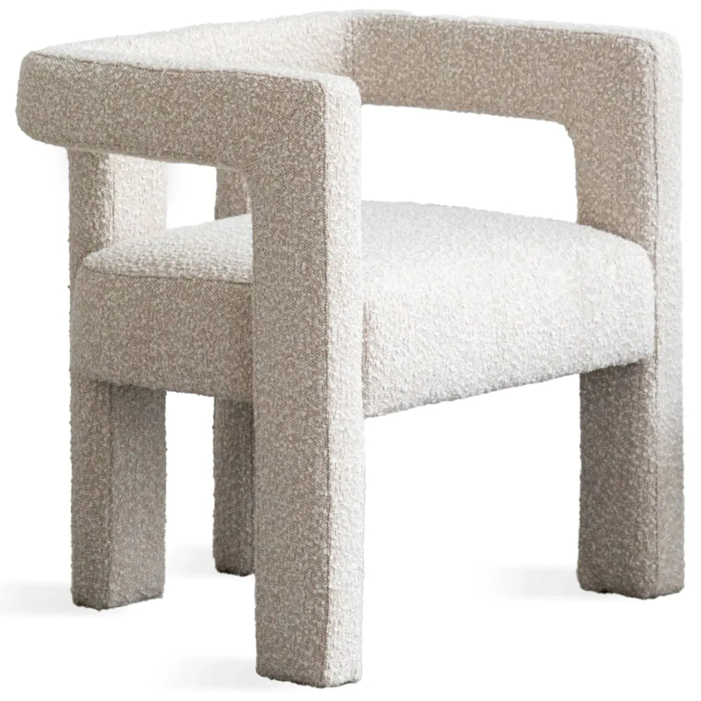 Modern boucle fabric dining chair whim in white background.