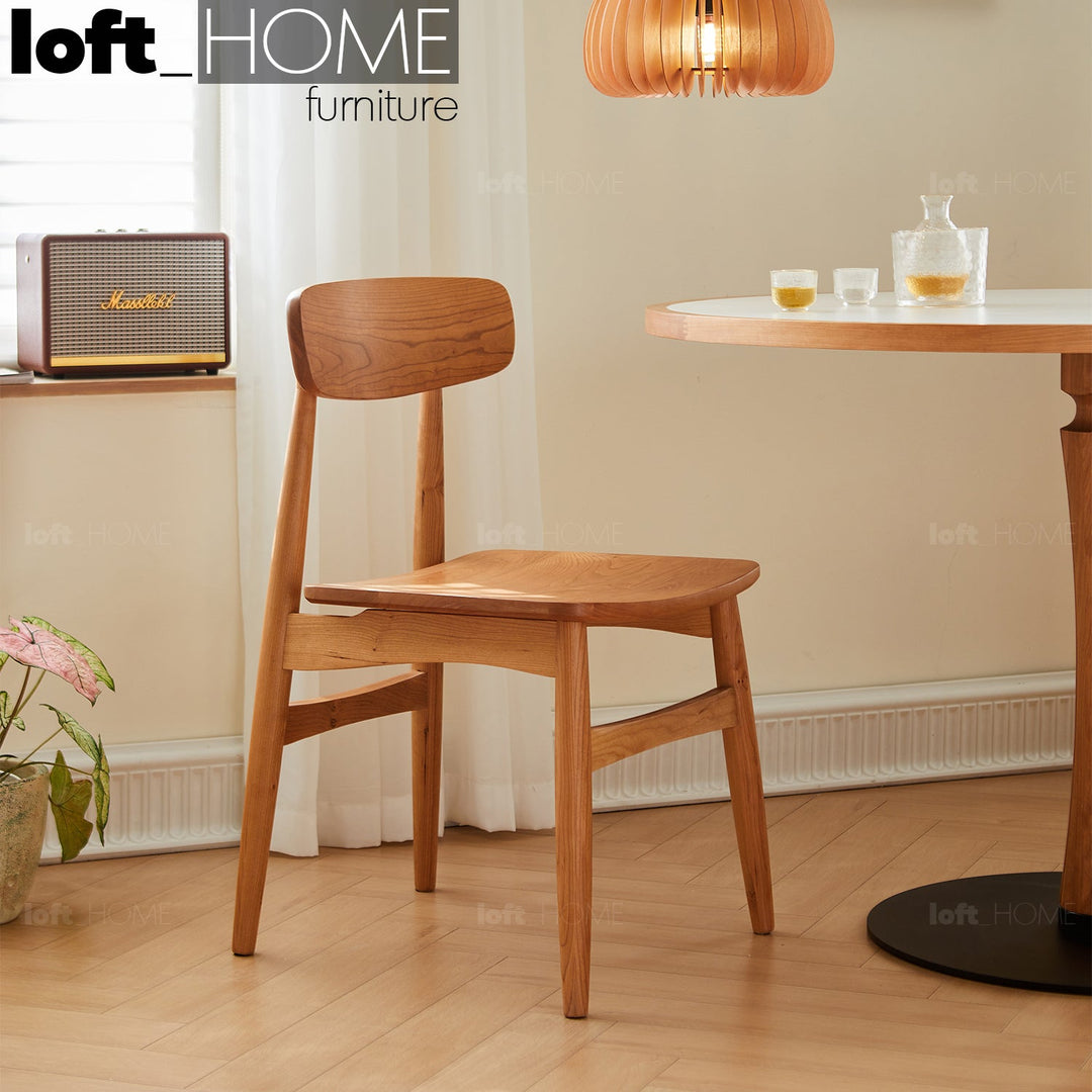 Scandinavian cherry wood dining chair buddy primary product view.