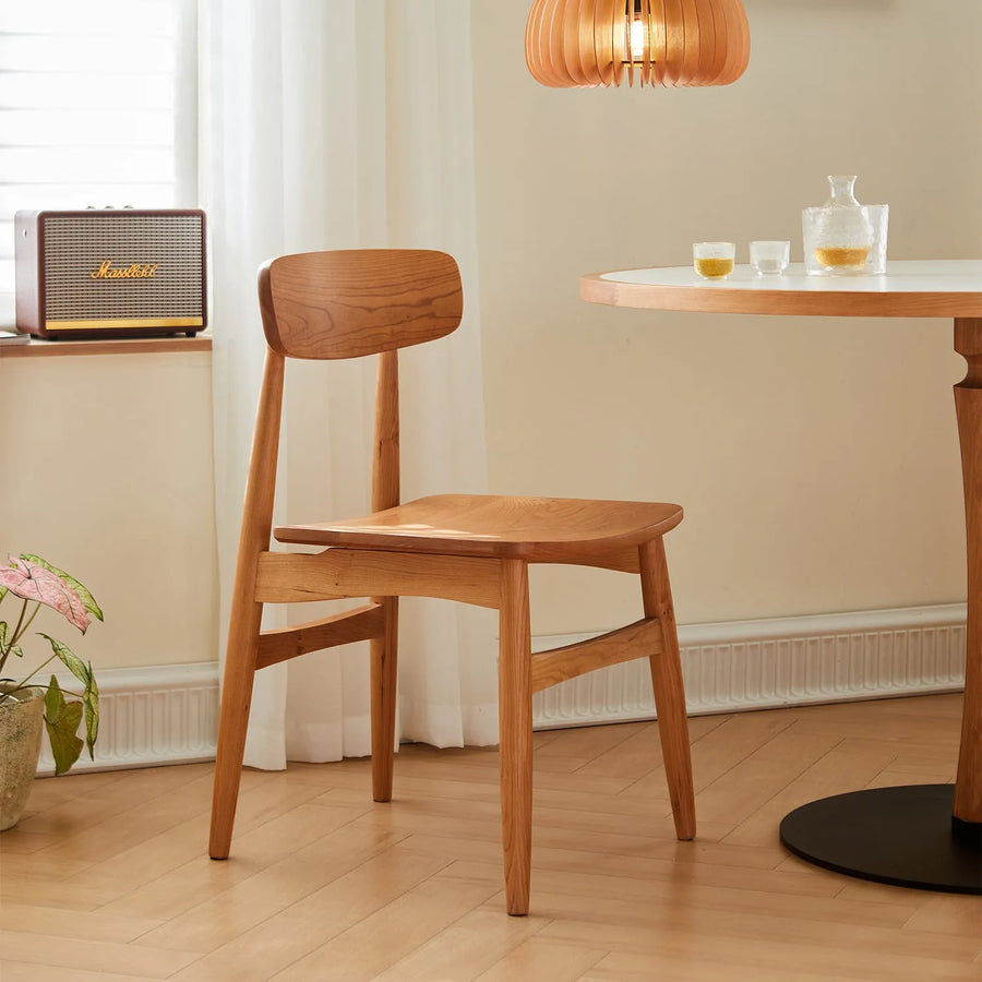 Scandinavian cherry wood dining chair buddy primary product view.