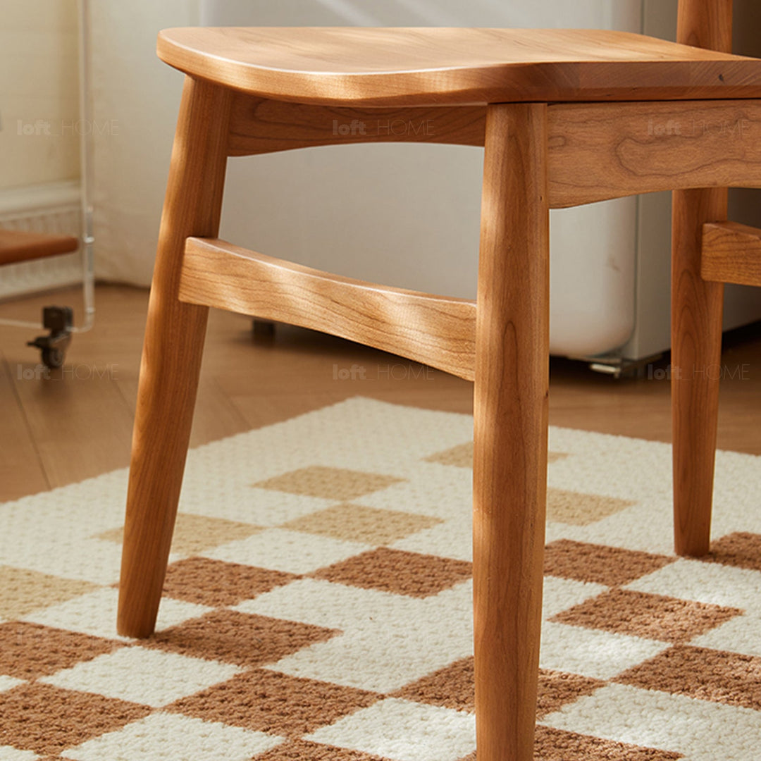 Scandinavian cherry wood dining chair buddy material variants.