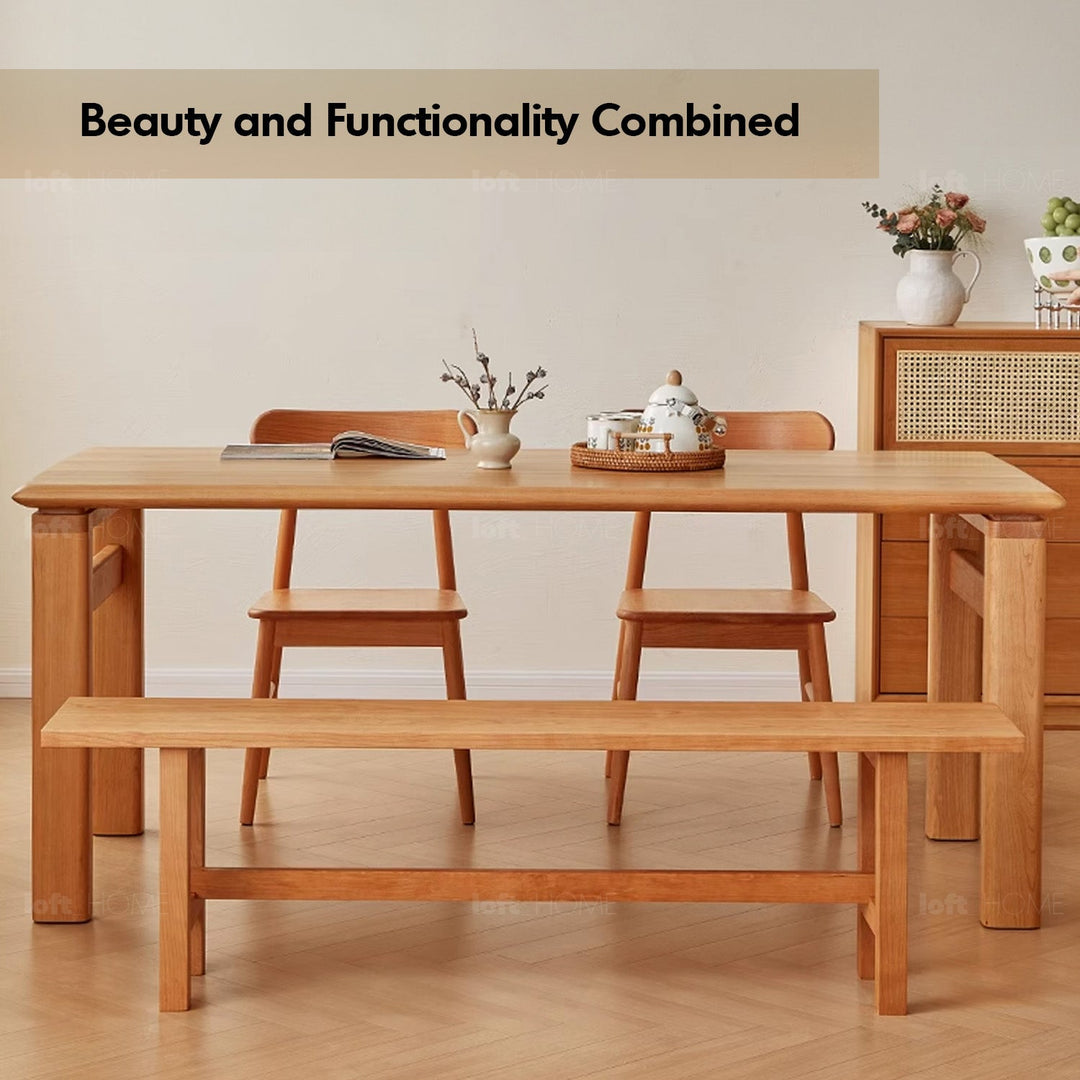 Scandinavian cherry wood dining table elate with context.
