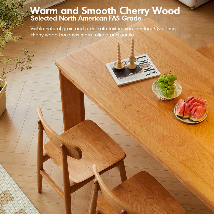 Scandinavian cherry wood dining table rhino with context.
