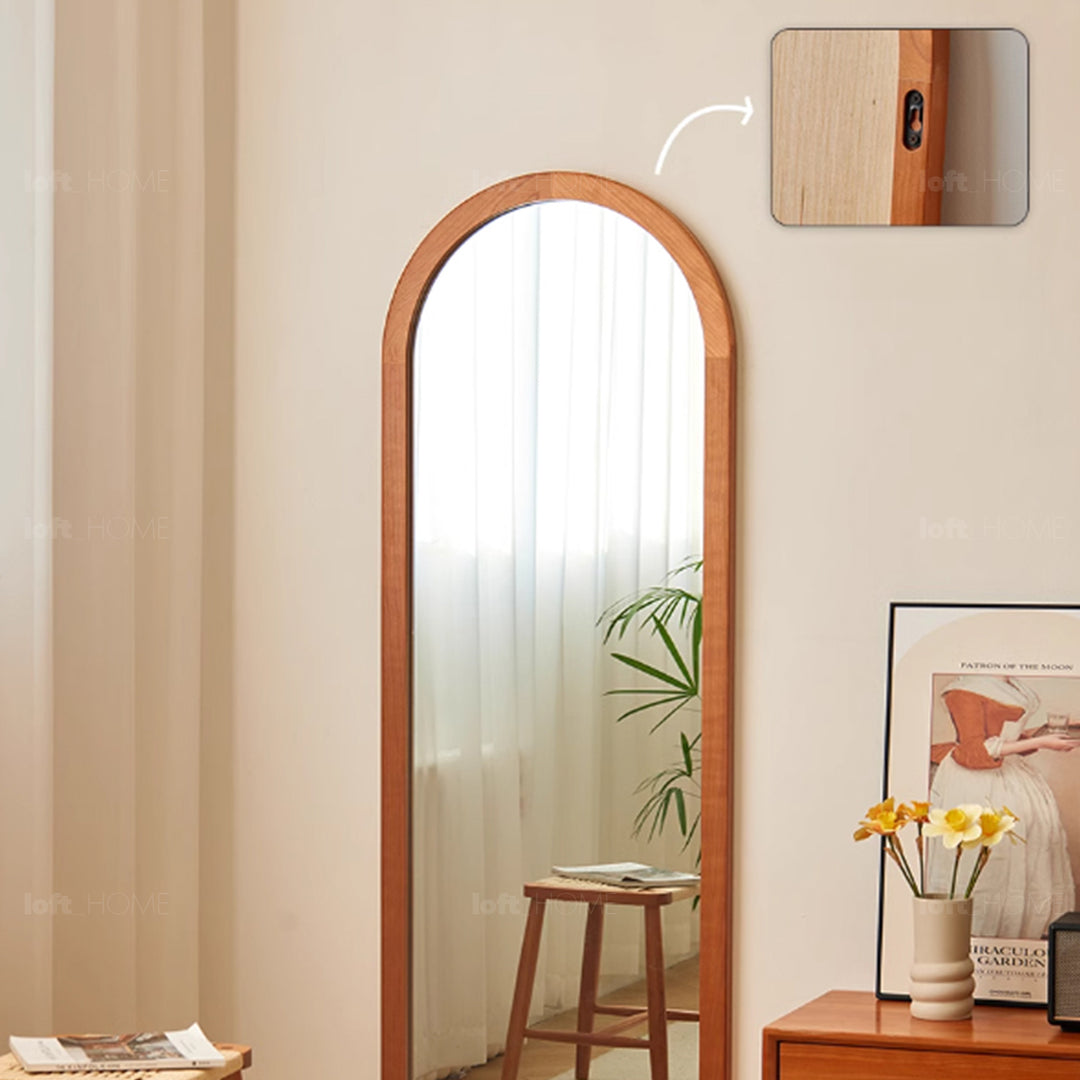 Scandinavian cherry wood wall hanging dressing mirror spacetime in close up details.