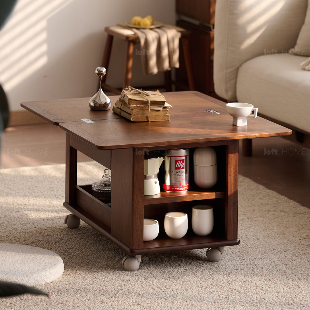 Scandinavian cherry wood extendable coffee table whisroll in still life.