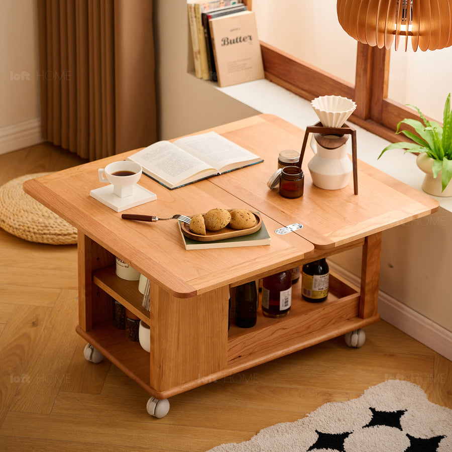 Scandinavian cherry wood extendable coffee table whisroll in real life style.