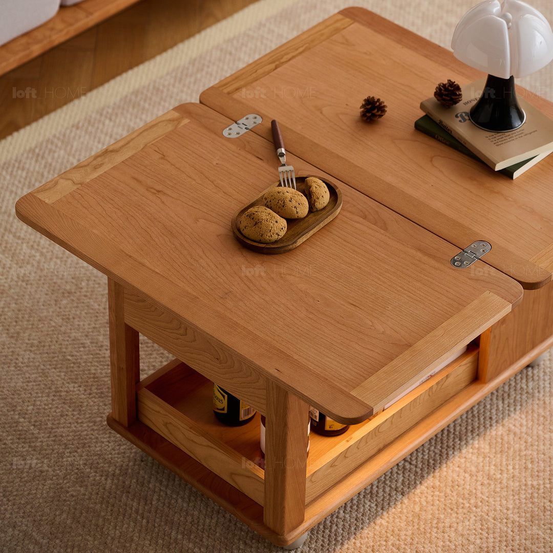 Scandinavian cherry wood extendable coffee table whisroll with context.