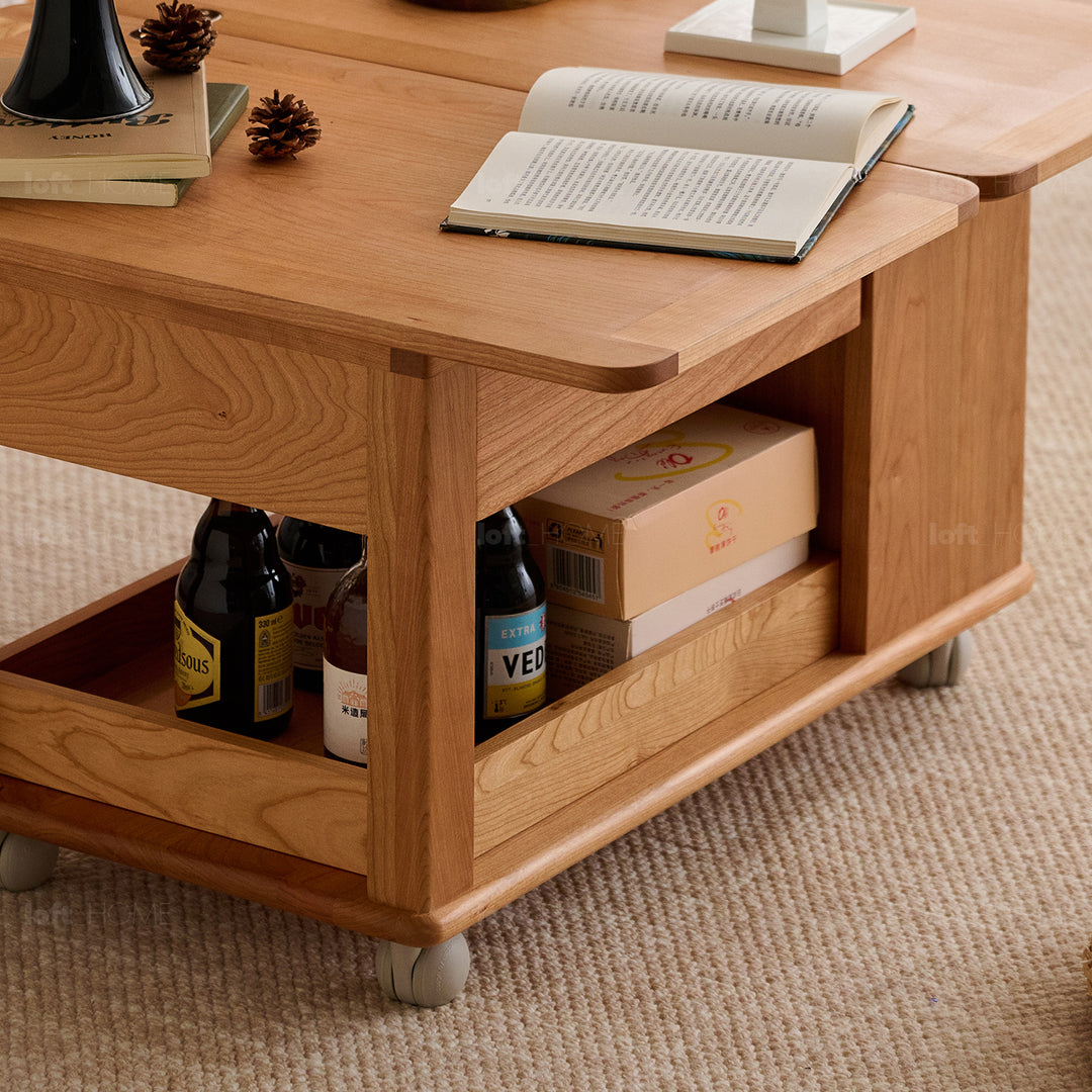 Scandinavian cherry wood extendable coffee table whisroll in details.