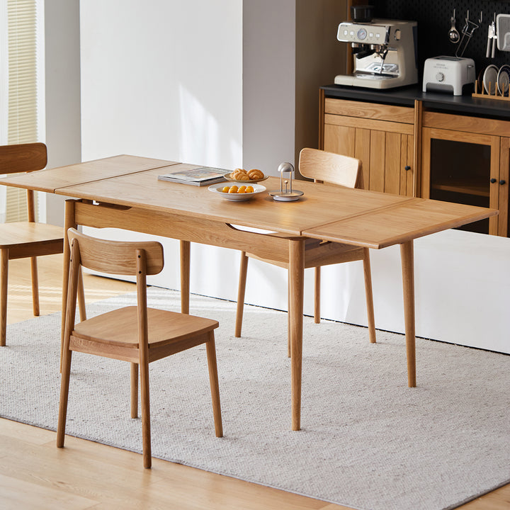 Scandinavian cherry wood extendable dining table mcgee in still life.