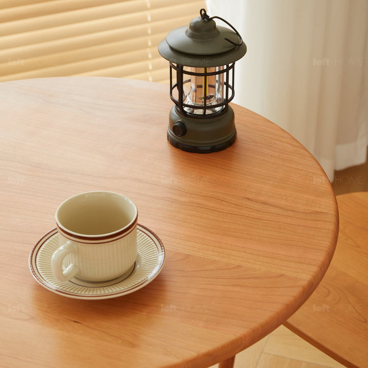 Scandinavian cherry wood height adjustable coffee table cherry material variants.