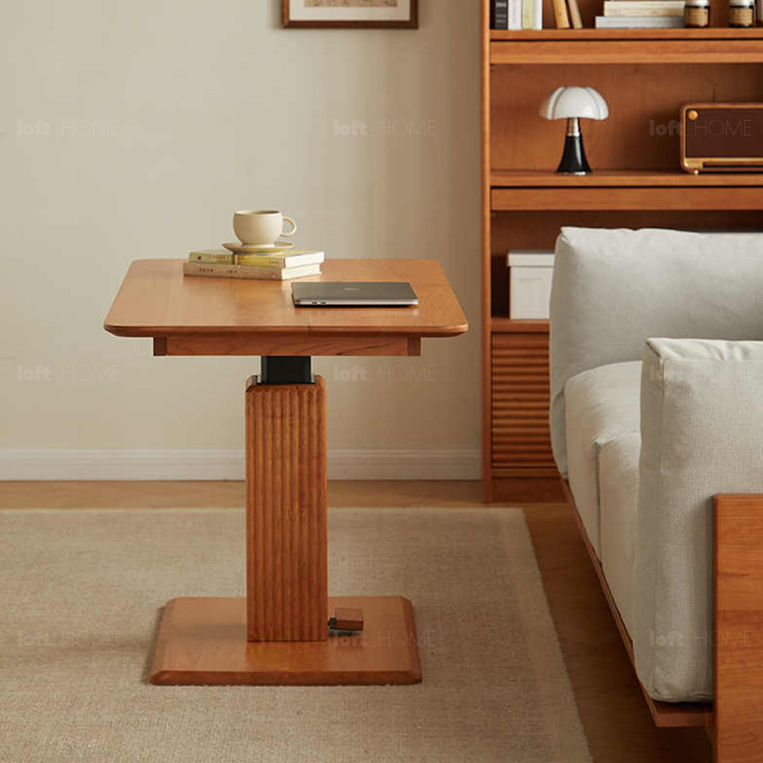 Scandinavian cherry wood height adjustable coffee table elevate with context.