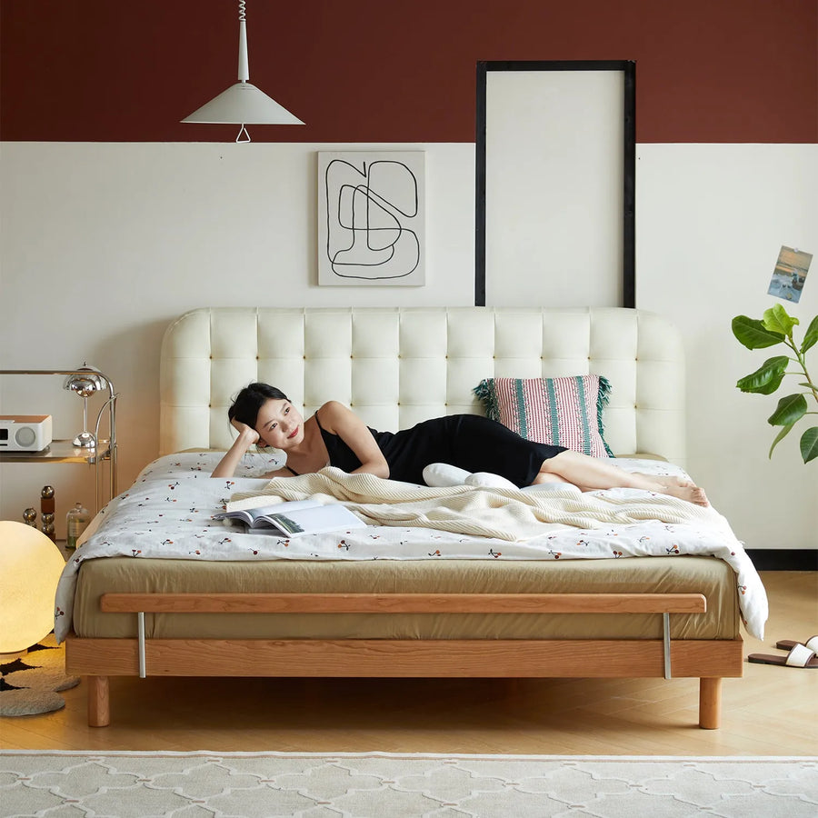 Scandinavian cherry wood leather bed skyline primary product view.