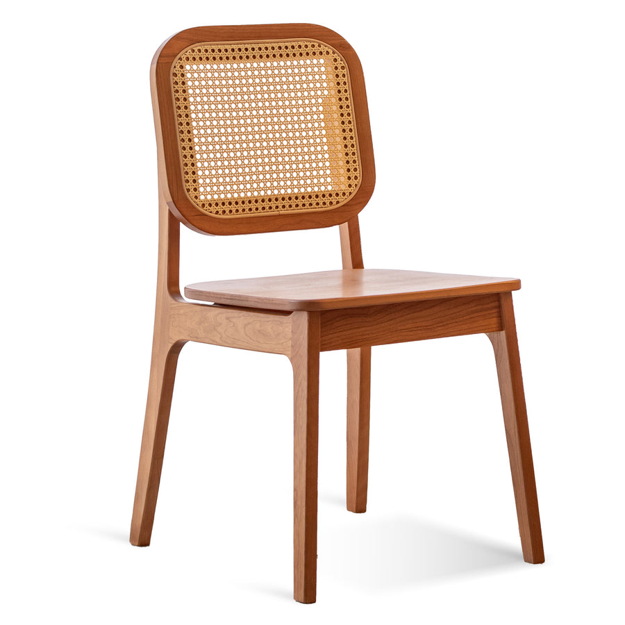 Scandinavian cherry wood rattan dining chair nook in white background.