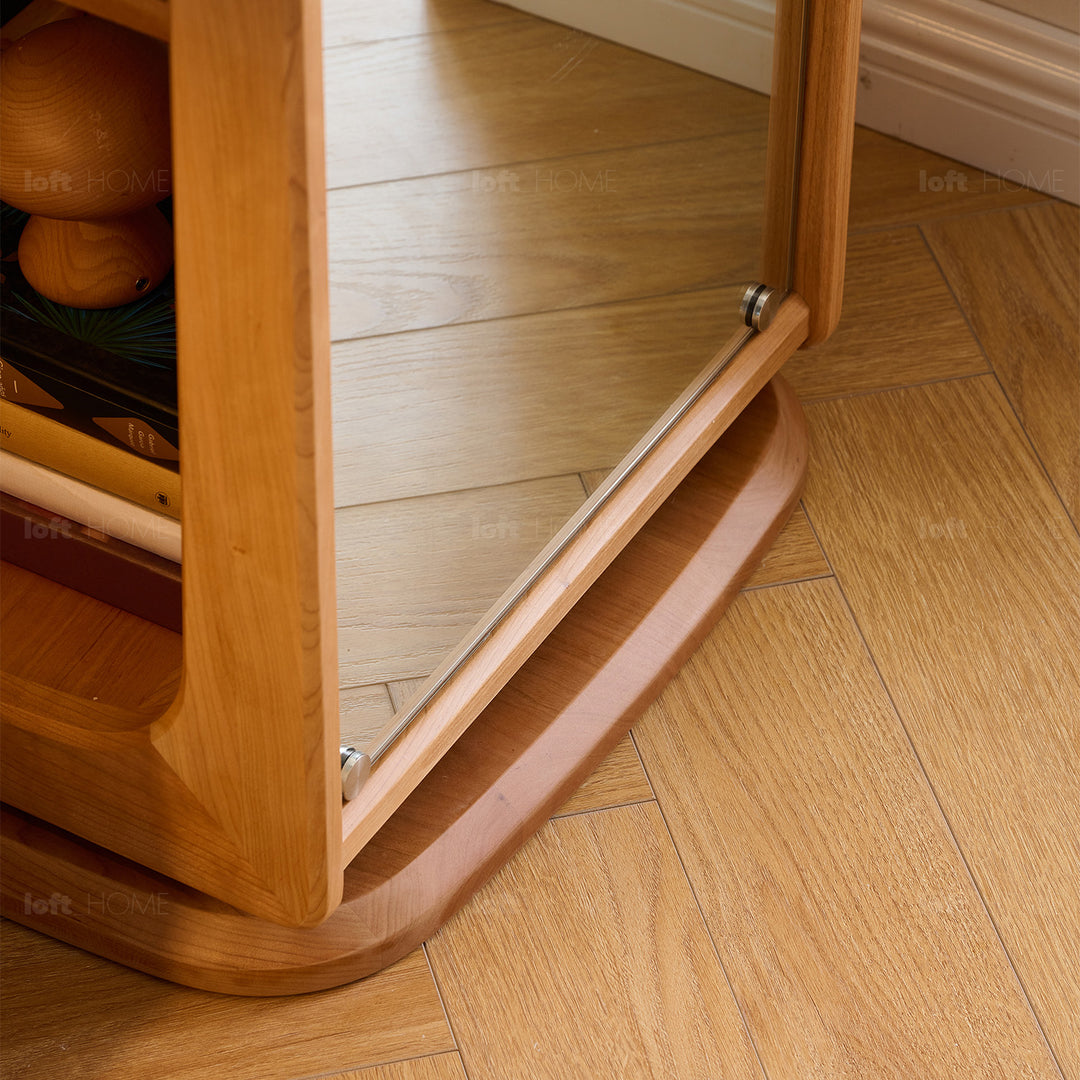 Scandinavian cherry wood revolving bookshelf with mirror moonlight in details.