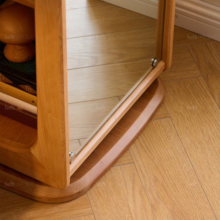 Scandinavian cherry wood revolving bookshelf with mirror moonlight in details.