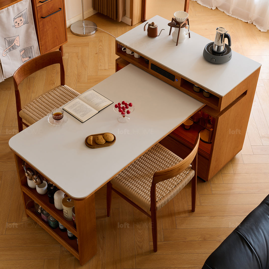 Scandinavian cherry wood sintered stone extendable island dining table with cabinet moonlight with context.