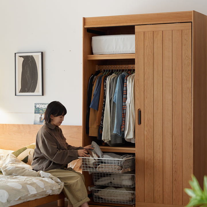 Scandinavian cherry wood sliding door wardrobe nava in panoramic view.