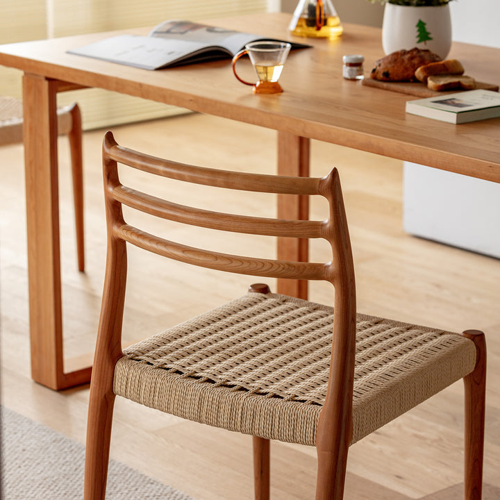 Scandinavian cherry wood woven rope dining chair autumn in details.