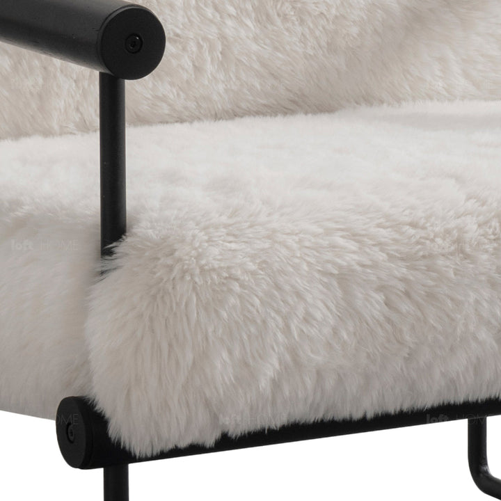 Scandinavian sherpa fabric 1 seater sofa snowy in still life.