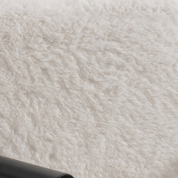 Scandinavian sherpa fabric 1 seater sofa snowy in close up details.