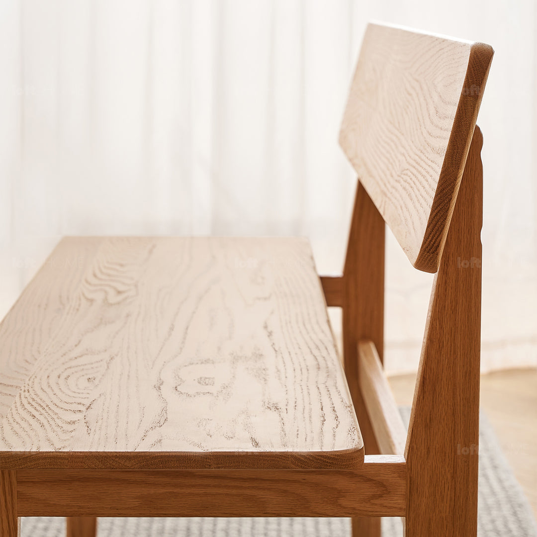 Scandinavian oak wood bench with backrest restly in panoramic view.