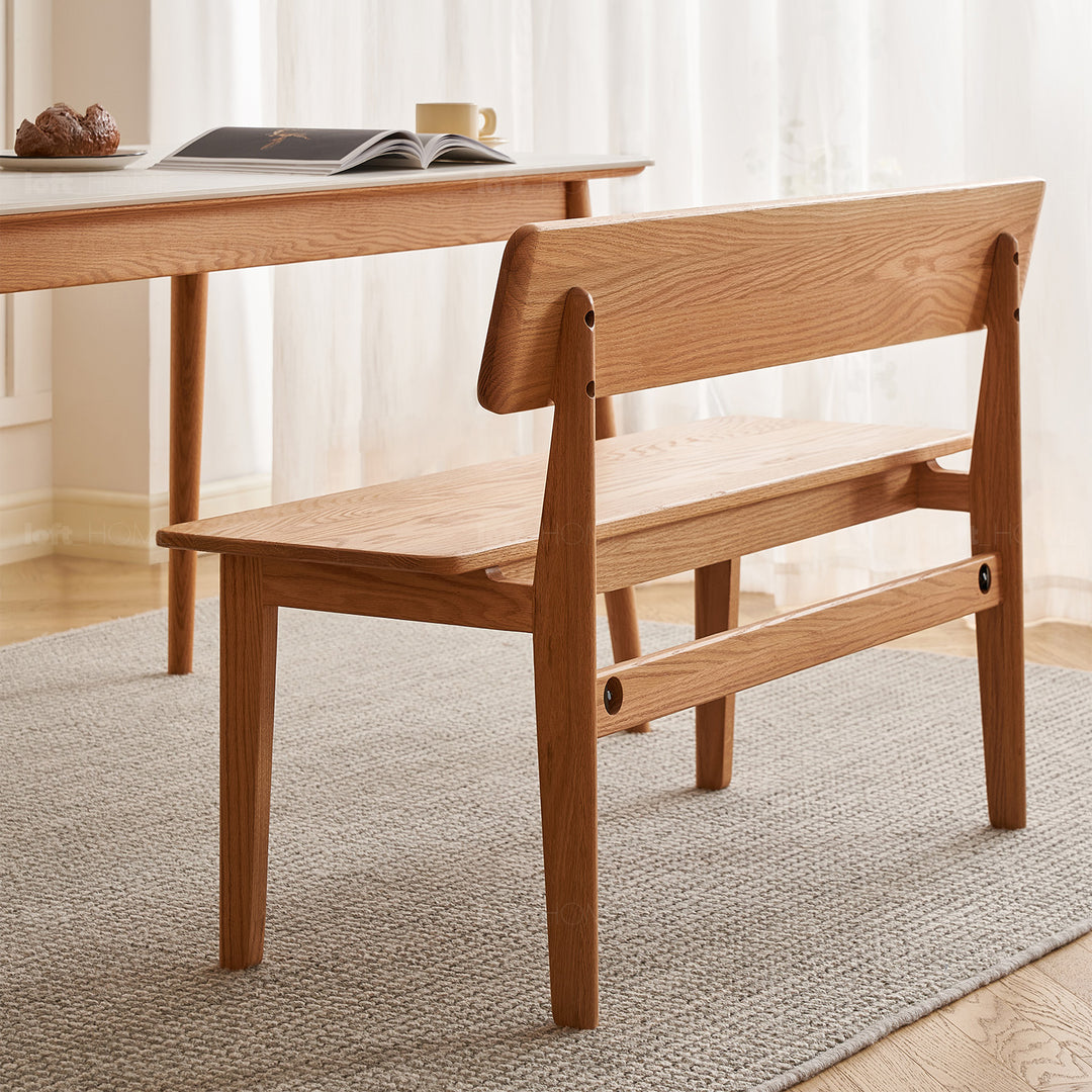 Scandinavian oak wood bench with backrest restly in close up details.