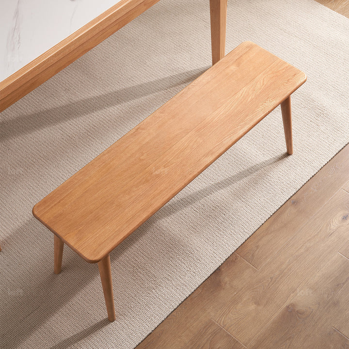 Scandinavian oak wood bench with cushion sereno with context.