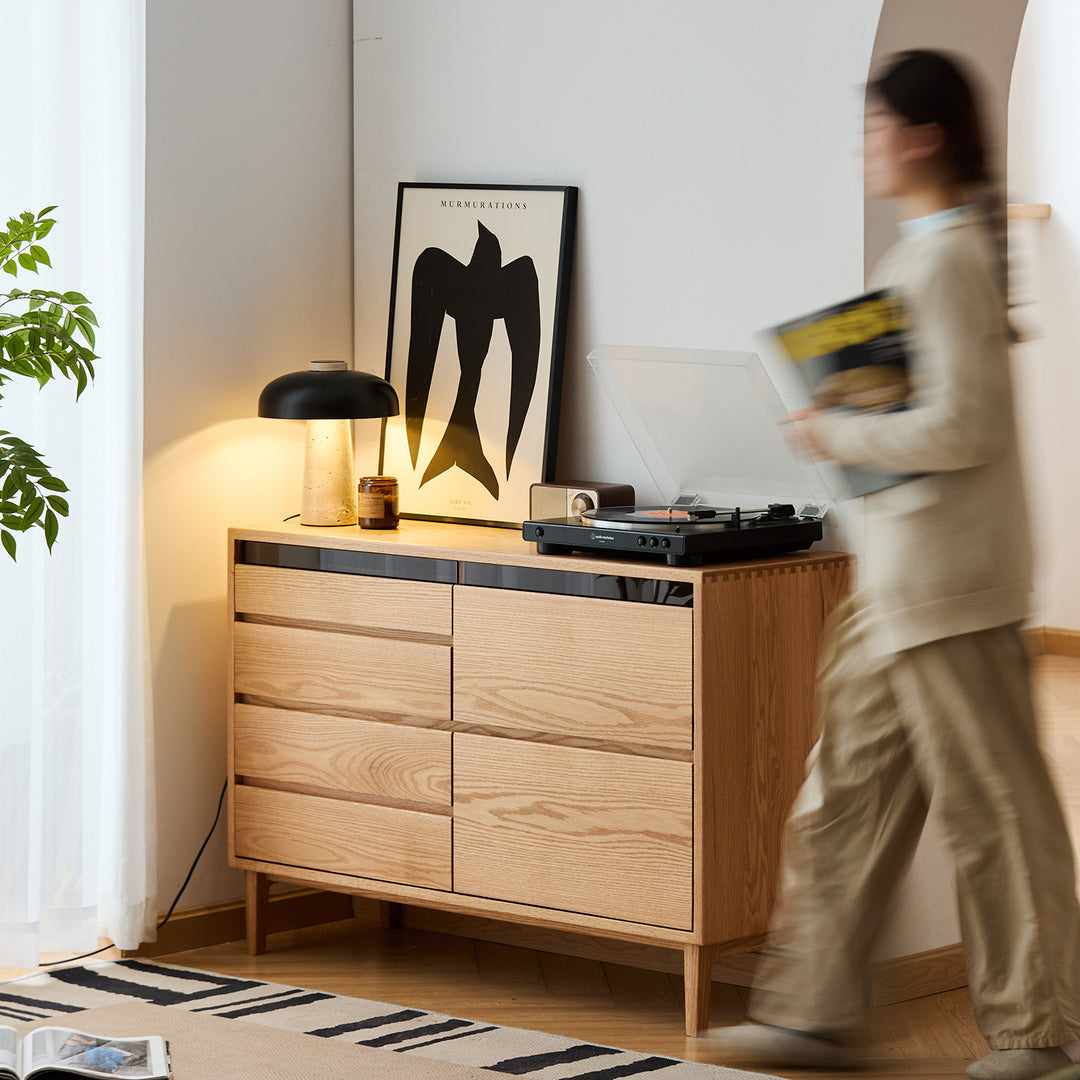 Scandinavian oak wood chest of 6 drawers floating light in panoramic view.