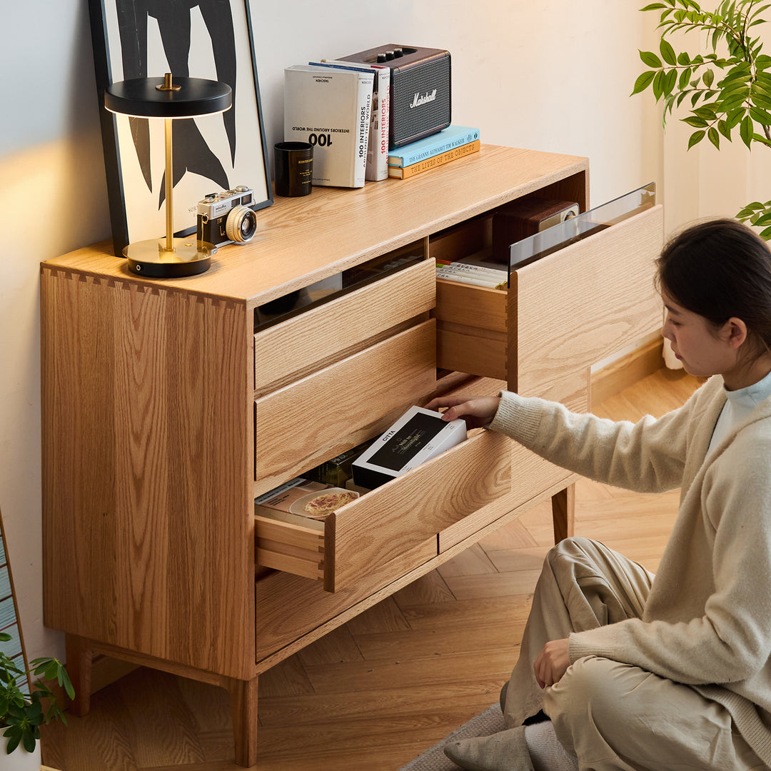 Scandinavian oak wood chest of 6 drawers floating light in details.