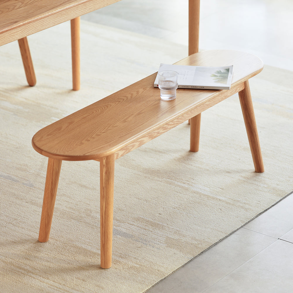 Scandinavian oak wood dining bench arc primary product view.