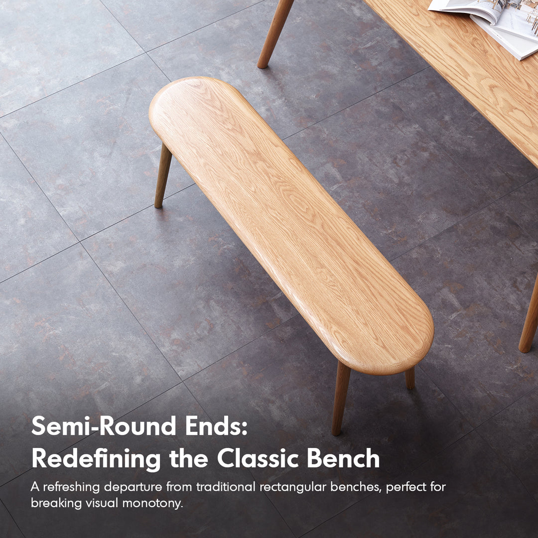 Scandinavian oak wood dining bench arc in close up details.