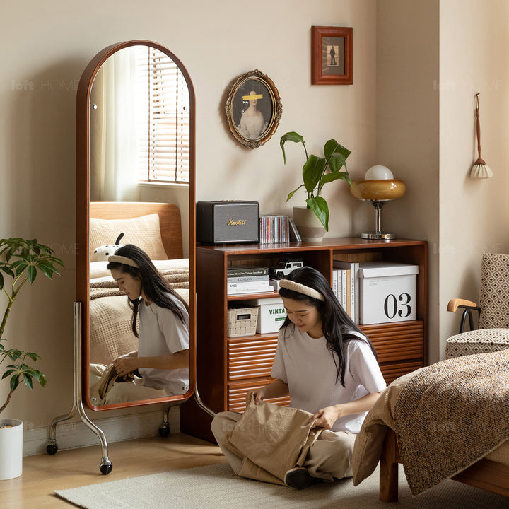 Scandinavian oak wood dressing mirror shelf with caster wheels vista with context.