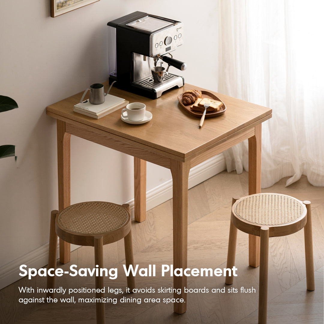 Scandinavian oak wood extendable dining table privot in still life.