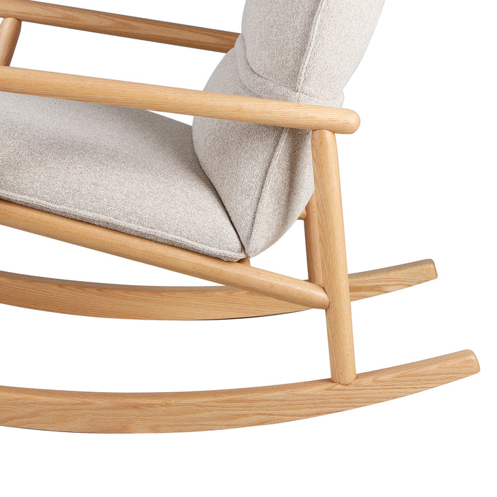 Scandinavian oak wood fabric rocking chair may in panoramic view.