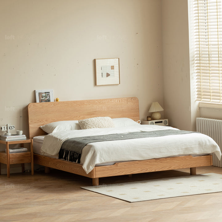 Scandinavian oak wood floating bed glide with context.