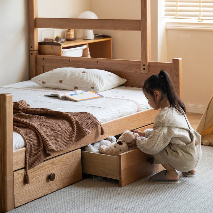 Scandinavian oak wood kids bunk bed with storage staircase and bottom drawers cloud in still life.